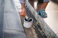 Man working with waterproofing material Royalty Free Stock Photo