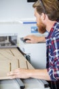 Man working on wood shaper