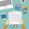 Man works with financial documents. Concept of paying bills, payments, taxes. Human hands hold the accounts, payroll, tax form. Royalty Free Stock Photo