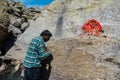 A man in worship at Parvati Kund, a sacred site on the Kinner Kailash Yatra pilgrimage