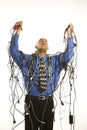 Man wrapped in cables. Royalty Free Stock Photo