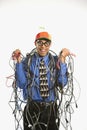 Man wrapped in cables. Royalty Free Stock Photo