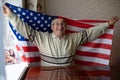 man is wrapped waving american USA flag