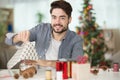 man wrapping christmas present Royalty Free Stock Photo