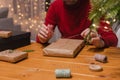 Man wrapping Christmas present at home Royalty Free Stock Photo