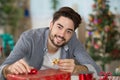 man wrapping gift Royalty Free Stock Photo
