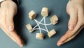 A man wraps his arms around a circle of employee figures. Collaboration and cooperation, teamwork, team insurance and people