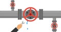 A man with a wrench eliminates the leak in the pipe. The hand holds a wrench and eliminates leakage in the water pipe.