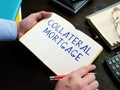 Man writes Collateral Mortgage sign on the sheet