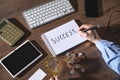 Man writes text Success in notepad Royalty Free Stock Photo