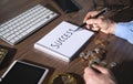 Man writes text Success in notepad Royalty Free Stock Photo