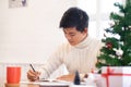 Man writing christmas and new year greeting cards Royalty Free Stock Photo