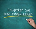 Man writing entdecken sie ihre moglichkeiten Royalty Free Stock Photo