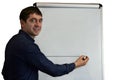 Man writing on a flipchart isolated on a white background
