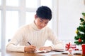 Man writing christmas and new year greeting cards Royalty Free Stock Photo