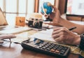 Man writing his travel plan on notebook Royalty Free Stock Photo