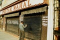 Man writing on house