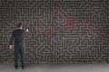Man writing on a maze background Royalty Free Stock Photo