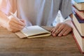 Man writing pen in book Royalty Free Stock Photo