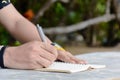 Man writing pen in book Royalty Free Stock Photo