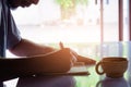 Man writing pen in book on white table Royalty Free Stock Photo