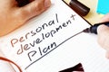 Man writing Personal development plan. Royalty Free Stock Photo