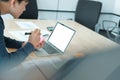 Man writing reminder on sticky note. male freelancer student working organizing plan at workplace Royalty Free Stock Photo