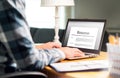 Man writing resume and CV in home office with laptop Royalty Free Stock Photo