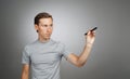 Man writing something with marker on glass board. Royalty Free Stock Photo