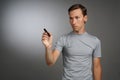 Man writing something with marker on glass board. Royalty Free Stock Photo