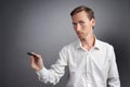 Man writing something with marker on glass board. Royalty Free Stock Photo