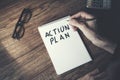 Man written action  plan text on notepa Royalty Free Stock Photo