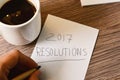 Man writting the text 2017 resolutions