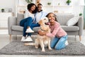 Young black girl hugging dog posing at home Royalty Free Stock Photo