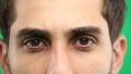 Man's eyes, close-up, on a green background Royalty Free Stock Photo