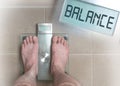 Man& x27;s feet on weight scale - Balance