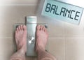 Man& x27;s feet on weight scale - Balance Royalty Free Stock Photo