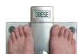 Man& x27;s feet on weight scale - Obese