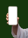 Man's hand holds smartphone with white screen on Islamic or Muslim green. Blank screen with space for copy or Royalty Free Stock Photo