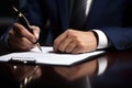 Man& x27;s hand signing a major financial contract with luxury pens. Male client putting signature at document in office