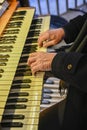 Man& x27;s hands playing a church organ Royalty Free Stock Photo