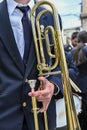 Man& x27;s hands playing the trombone in the orchestra Royalty Free Stock Photo