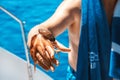 Man on a yacht, he caught an octopus from the sea. Royalty Free Stock Photo