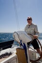 Man at yacht Helm Royalty Free Stock Photo