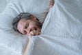 Man yawning in bed. Yawn and nap. Snore sleepy napping yawning wake up. Mattress pillow bed. Slumber overslept. Morning Royalty Free Stock Photo