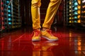 A man in yellow leather pants and sneakers Royalty Free Stock Photo