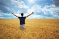Man in yellow wheat meadow Royalty Free Stock Photo