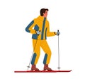Man in yellow winter sportswear with blue accents is skiing holding ski poles in his hands. The concept of active