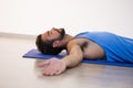 Man in yoga corpse pose Royalty Free Stock Photo