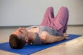 Man in yoga corpse pose Royalty Free Stock Photo